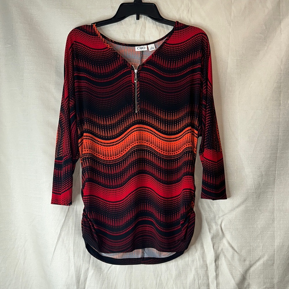 Cato Blouse. Size Large Orange hued with zipand  ruched cinched side detail